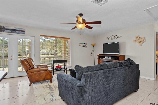 160 Lookout Point Dr, Grapeland, TX 75844 - living area with attic access, french doors, visible vents, and light tile patterned flooring