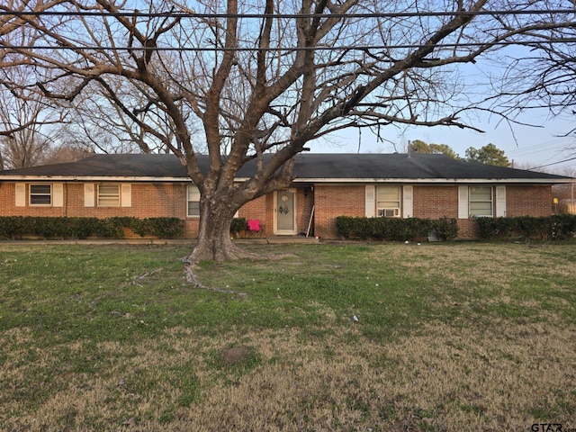 ranch-style house with a front lawn