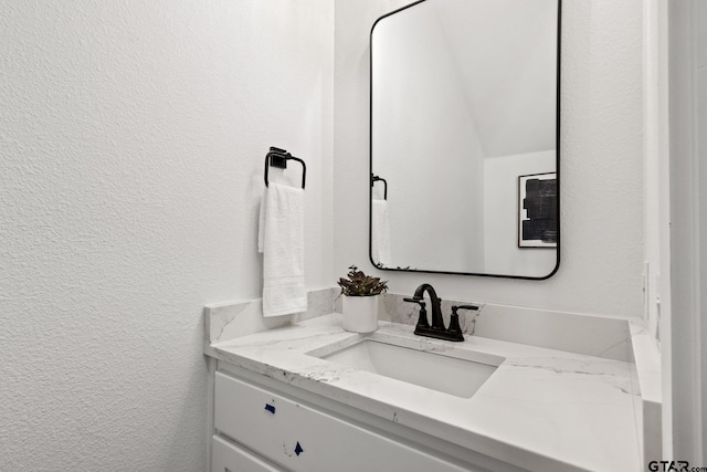 188 W 17th, Mount Pleasant, TX 75455 - bathroom with vanity and a textured wall