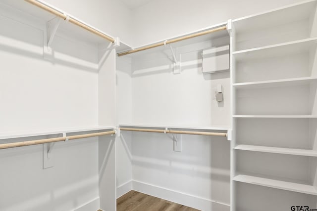 spacious closet with wood finished floors
