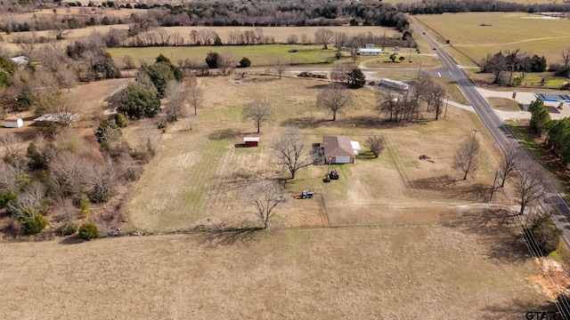 birds eye view of property with a rural view