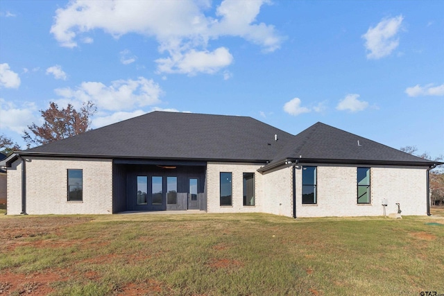 back of house featuring a yard