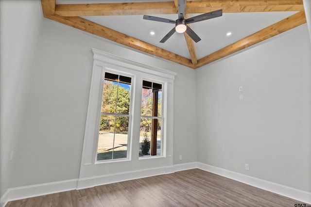 unfurnished room with dark hardwood / wood-style flooring, plenty of natural light, and ceiling fan