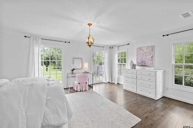 2417 Old Bullard Rd, Tyler, TX 75701 - bedroom featuring multiple windows, a chandelier, dark wood finished floors, and ornamental molding