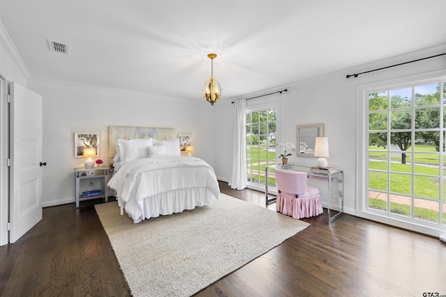 2417 Old Bullard Rd, Tyler, TX 75701 - bedroom with ornamental molding, a chandelier, and dark wood-style flooring