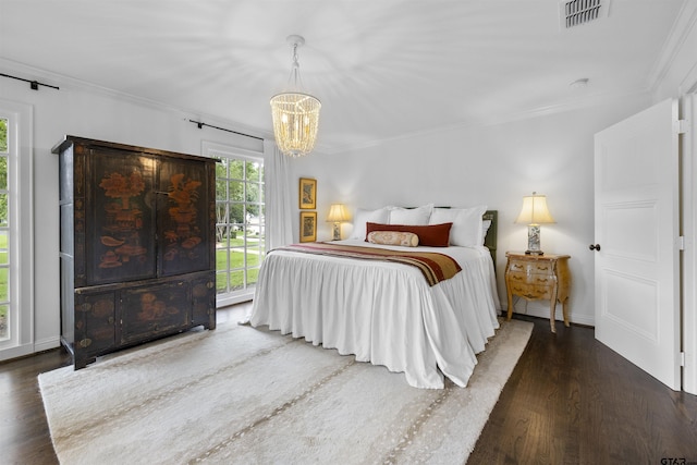 2417 Old Bullard Rd, Tyler, TX 75701 - bedroom featuring crown molding, a chandelier, and wood finished floors