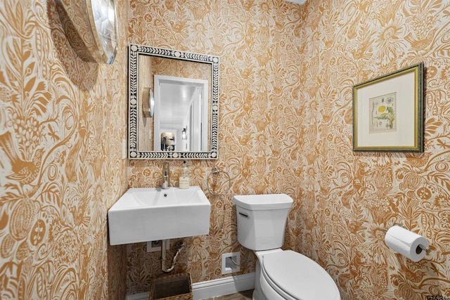 2417 Old Bullard Rd, Tyler, TX 75701 - bathroom with wallpapered walls and toilet