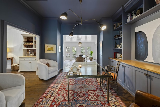 2417 Old Bullard Rd, Tyler, TX 75701 - office area with ornamental molding, built in shelves, dark wood finished floors, and a dry bar