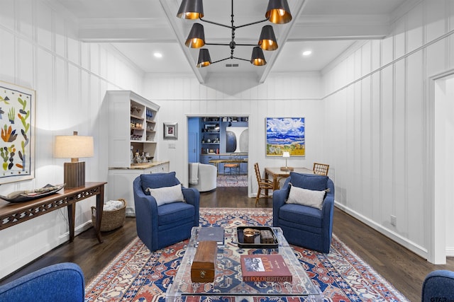 2417 Old Bullard Rd, Tyler, TX 75701 - living room featuring a decorative wall, wood finished floors, a chandelier, ornamental molding, and coffered ceiling