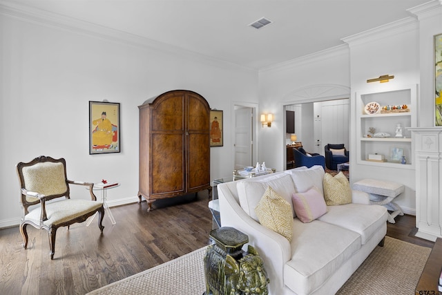 2417 Old Bullard Rd, Tyler, TX 75701 - living room featuring crown molding, dark wood-type flooring, and built in features