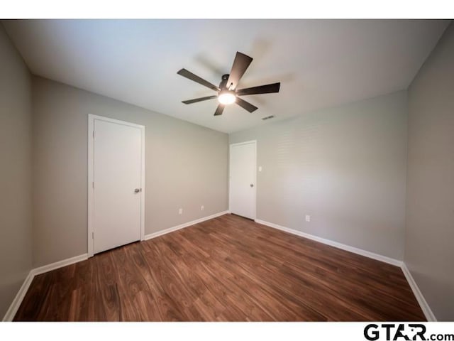 411 Lakeview St, Whitehouse, TX 75791 - unfurnished bedroom with wood finished floors and ceiling fan
