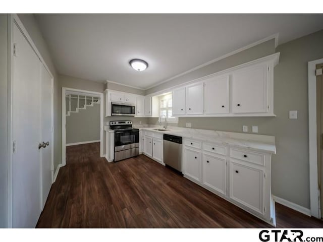 411 Lakeview St, Whitehouse, TX 75791 - kitchen with appliances with stainless steel finishes, white cabinetry, and dark wood-style flooring