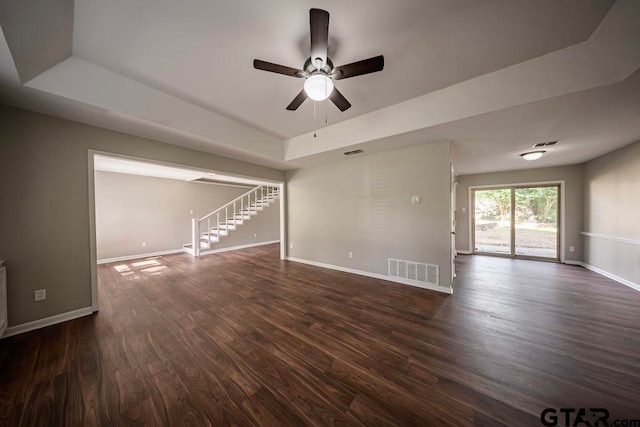 411 Lakeview St, Whitehouse, TX 75791 - unfurnished living room featuring a raised ceiling, a ceiling fan, and dark wood finished floors