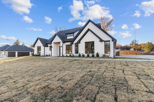 modern farmhouse featuring a front yard