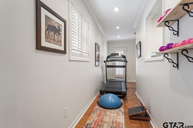 exercise room featuring baseboards, recessed lighting, and crown molding