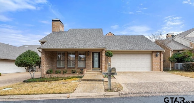 view of front of home featuring a garage, a shingled roof, concrete driveway, a chimney, and brick siding