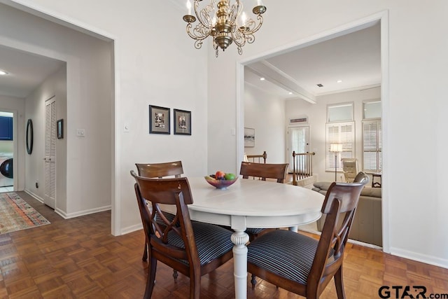 dining space featuring a notable chandelier, recessed lighting, washer / dryer, and baseboards