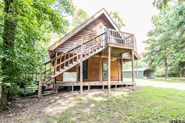 back of house featuring a yard and a carport