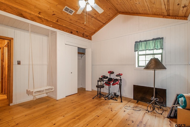 interior space featuring light hardwood / wood-style floors, vaulted ceiling, ceiling fan, and wooden ceiling