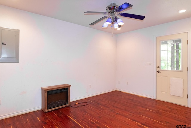 interior space featuring dark hardwood / wood-style floors, ceiling fan, and electric panel