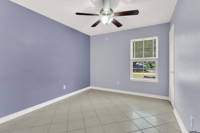 8811 Pheasant Dr, Chandler, TX 75758 - unfurnished room featuring ceiling fan, baseboards, and light tile patterned floors