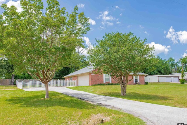 8811 Pheasant Dr, Chandler, TX 75758 - view of front facade with brick siding and driveway