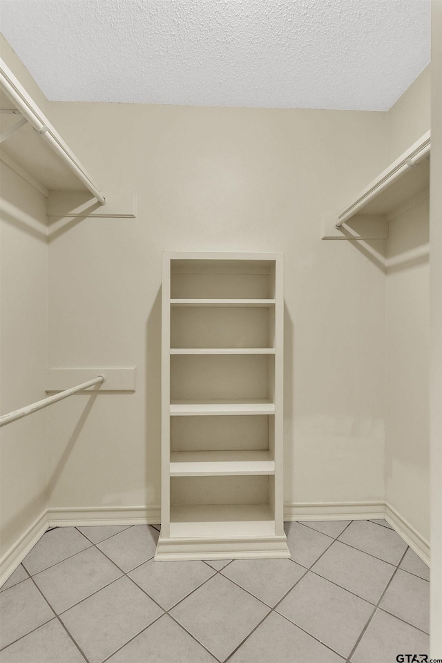 8811 Pheasant Dr, Chandler, TX 75758 - walk in closet with tile patterned floors