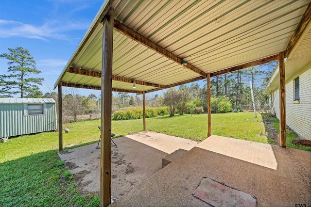 view of patio / terrace featuring an outdoor structure and a storage shed