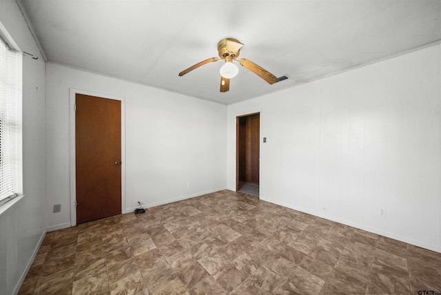unfurnished room featuring ceiling fan