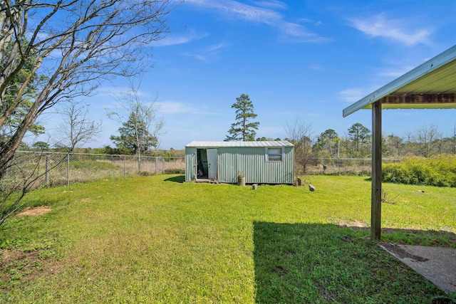 view of yard featuring an outbuilding, a fenced backyard, and a storage shed