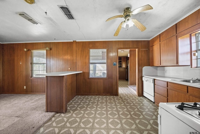 kitchen with white appliances, visible vents, and light countertops