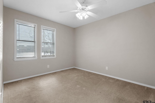 unfurnished room with carpet flooring and ceiling fan