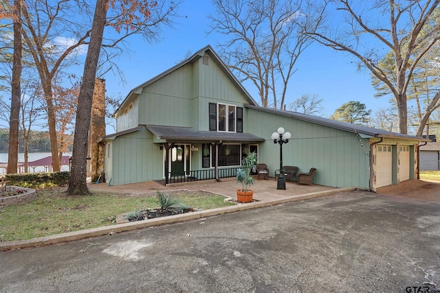 view of front of house with a garage and covered porch