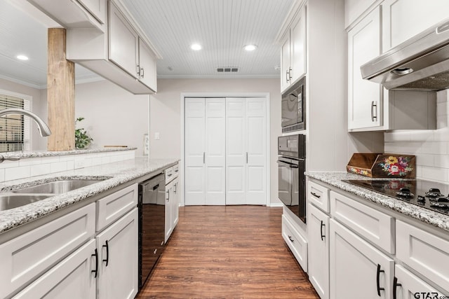 kitchen featuring white cabinetry, sink, range hood, crown molding, and black appliances