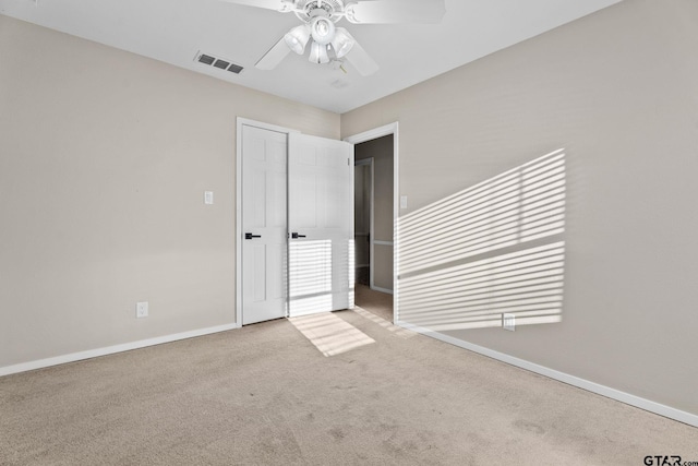 unfurnished bedroom with ceiling fan and light carpet