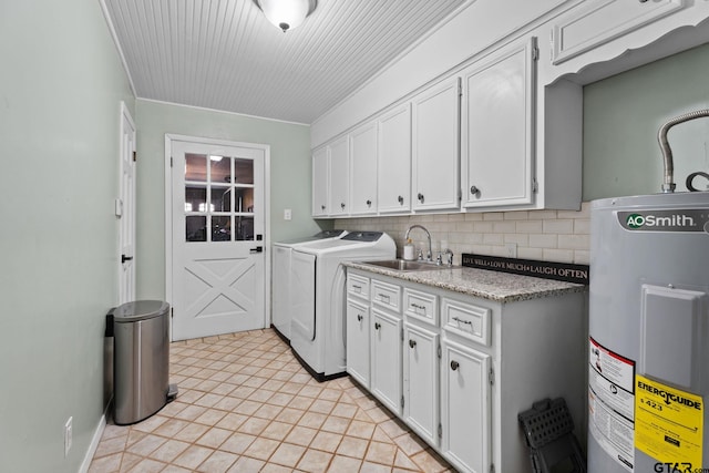 washroom with washer and clothes dryer, cabinets, sink, water heater, and light tile patterned flooring