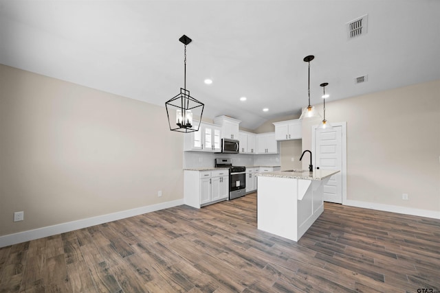 16221 Crossing Cir, Lindale, TX 75771 - kitchen featuring stainless steel appliances, dark wood-style flooring, white cabinets, pendant lighting, and recessed lighting