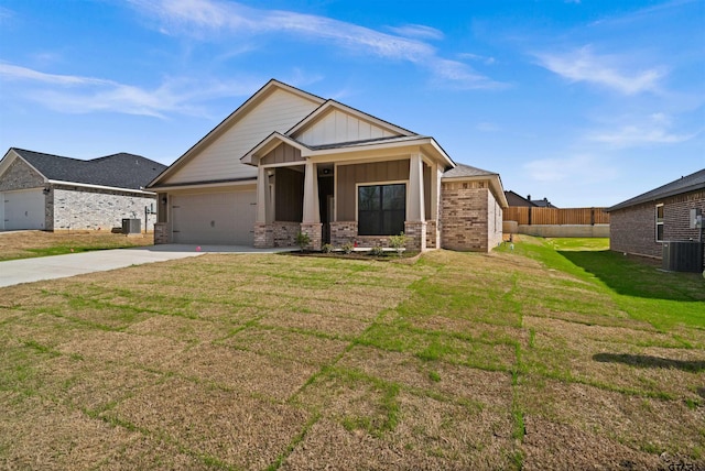 craftsman-style house with central AC, a garage, and a front yard