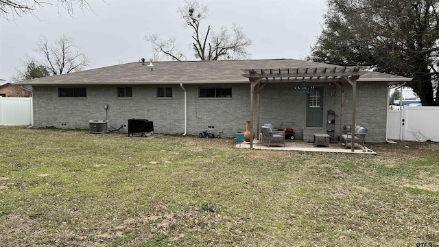 rear view of property with a patio, brick siding, crawl space, and fence