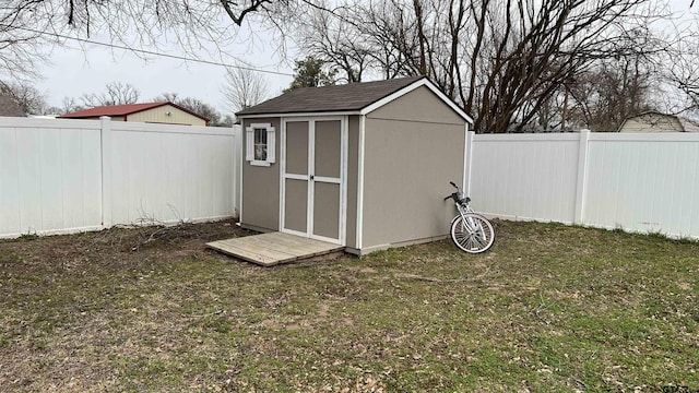 view of shed with a fenced backyard