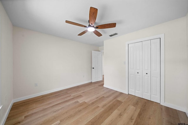 912 S Palmer Ave, Tyler, TX 75701 - unfurnished bedroom with light wood finished floors, a closet, and ceiling fan