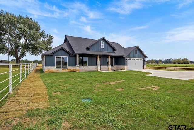 view of front of house featuring a garage and a front lawn