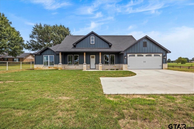 craftsman-style home with a garage and a front lawn