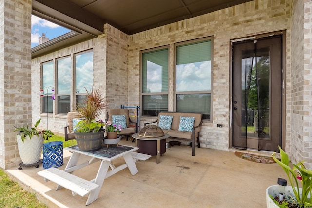 9157 Teal Flight Way, Tyler, TX 75703 - view of patio with an outdoor living space with a fire pit