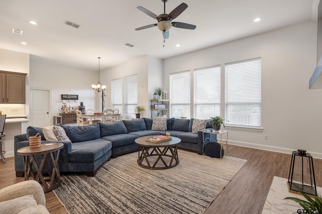 9157 Teal Flight Way, Tyler, TX 75703 - living area featuring a ceiling fan, a chandelier, wood finished floors, recessed lighting, and baseboards
