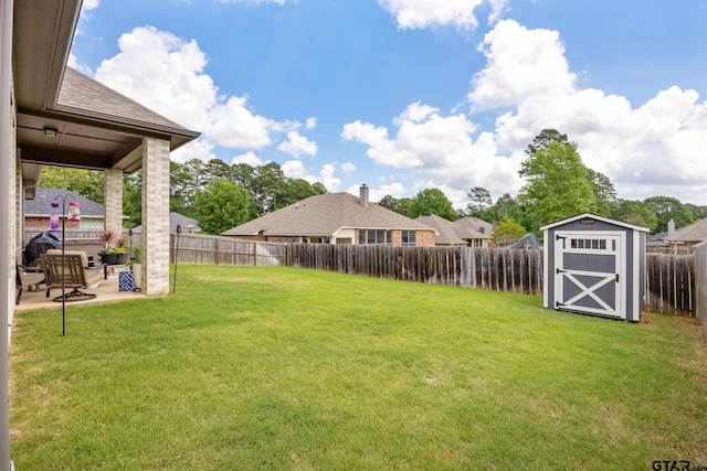 9157 Teal Flight Way, Tyler, TX 75703 - view of yard featuring a storage unit, a patio, and an outdoor structure