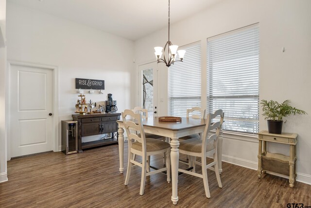 9157 Teal Flight Way, Tyler, TX 75703 - dining space with a chandelier, dark wood-type flooring, and baseboards