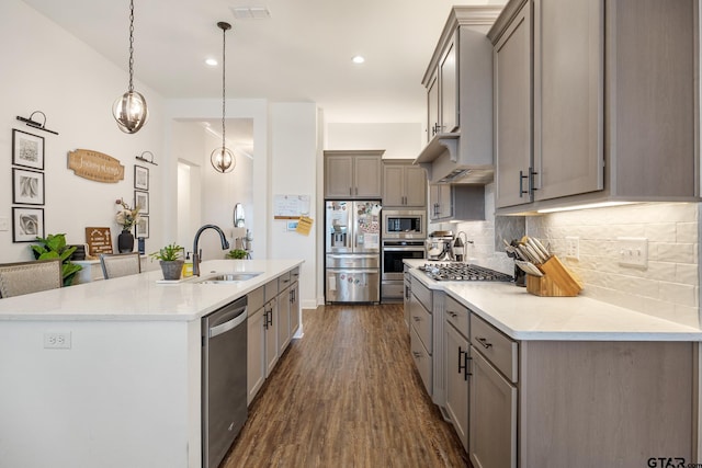 9157 Teal Flight Way, Tyler, TX 75703 - kitchen featuring appliances with stainless steel finishes, gray cabinets, a sink, dark wood-style flooring, and recessed lighting