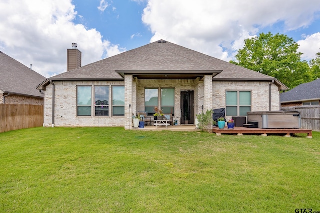 9157 Teal Flight Way, Tyler, TX 75703 - back of property featuring brick siding, a shingled roof, a wooden deck, a chimney, and a patio