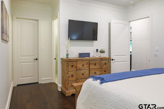 bedroom featuring ornamental molding and dark hardwood / wood-style flooring